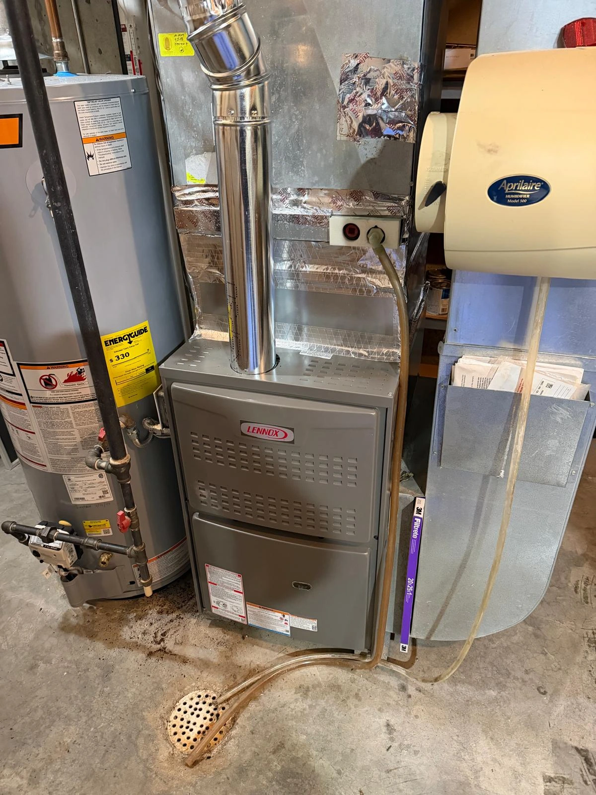 Lennox home furnace unit integrated with an Aprilaire humidifier system
